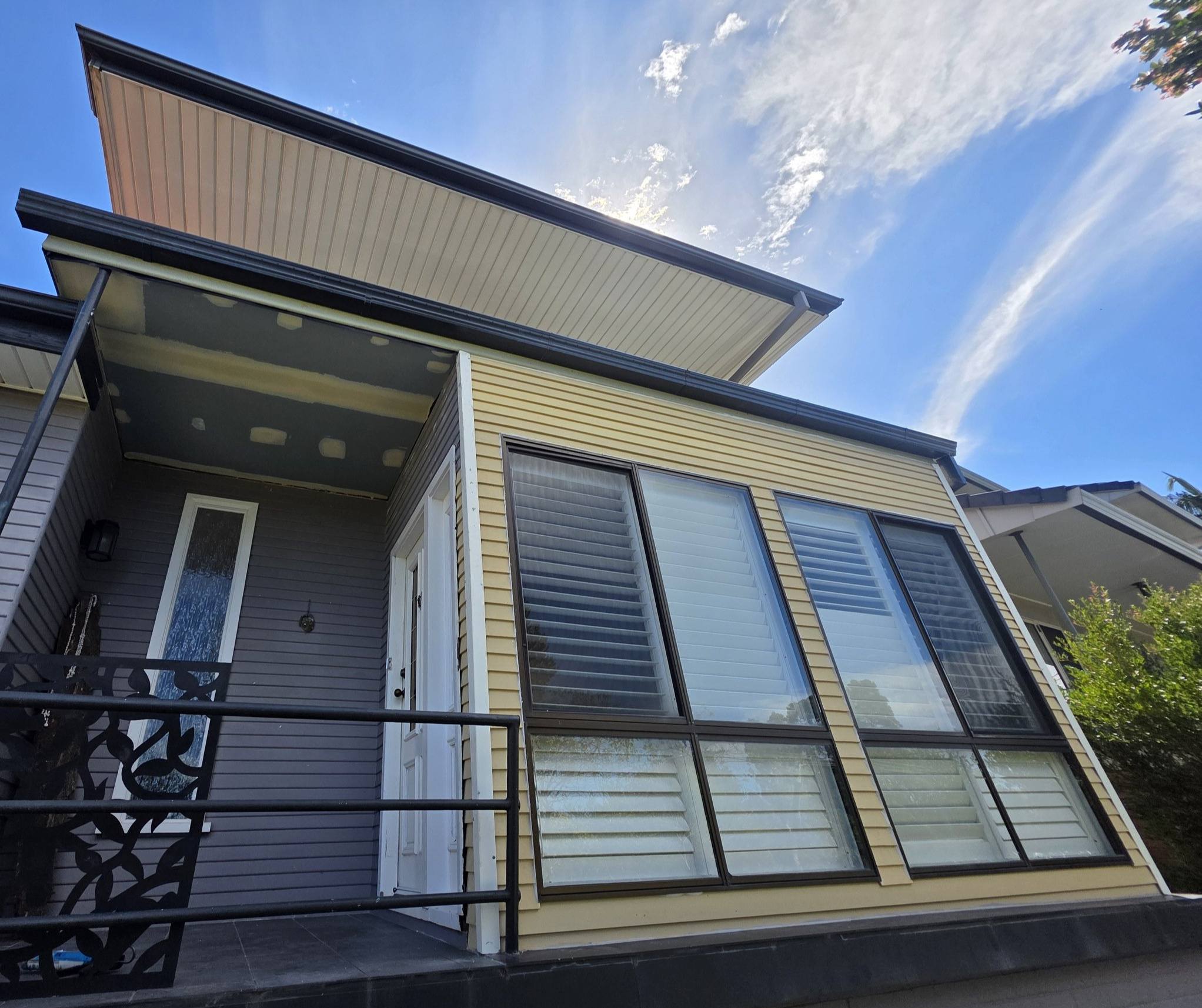Finished two storey home with new cladding, balustrade and screens