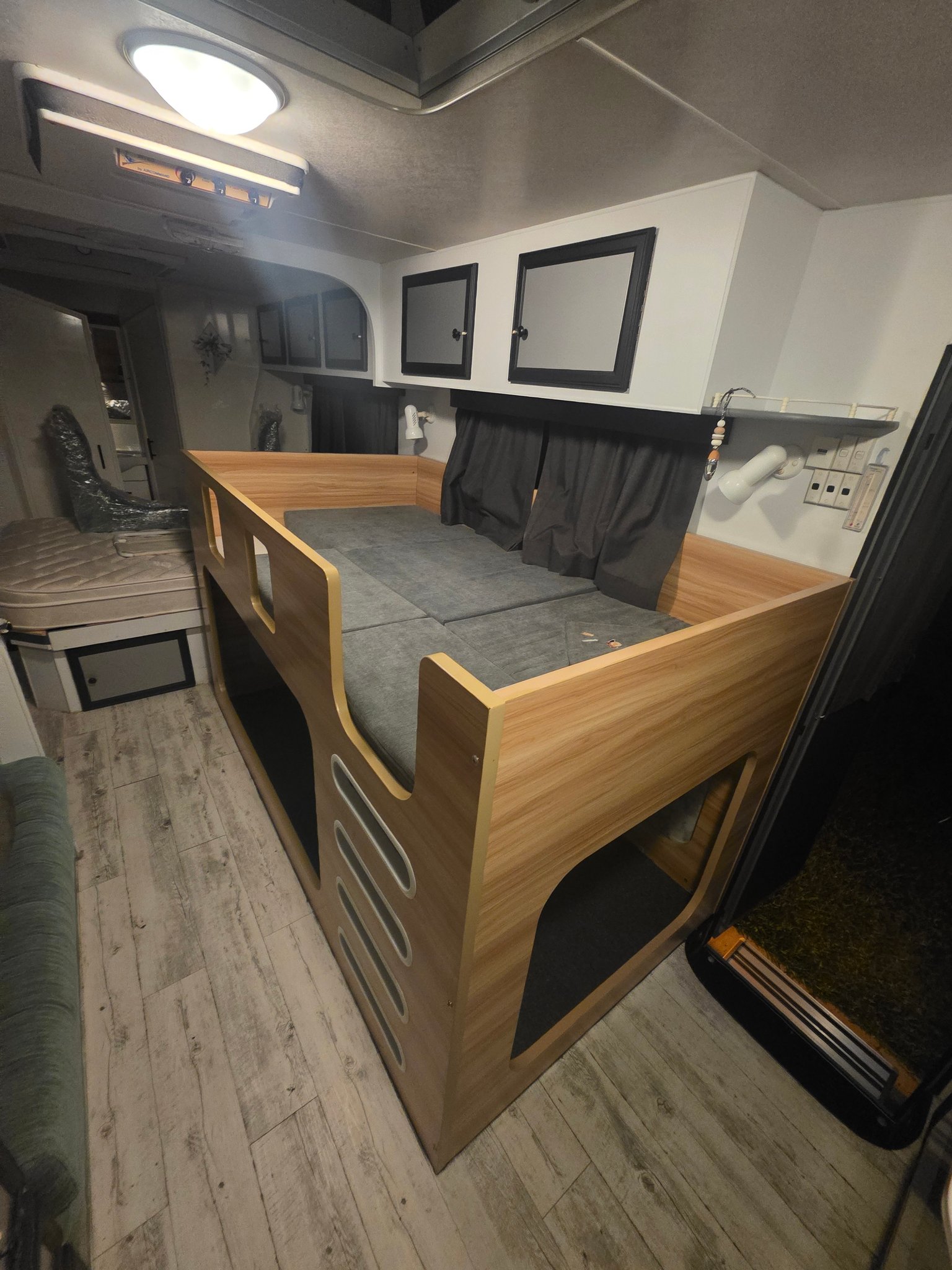 Caravan interior with custom timber bunk beds