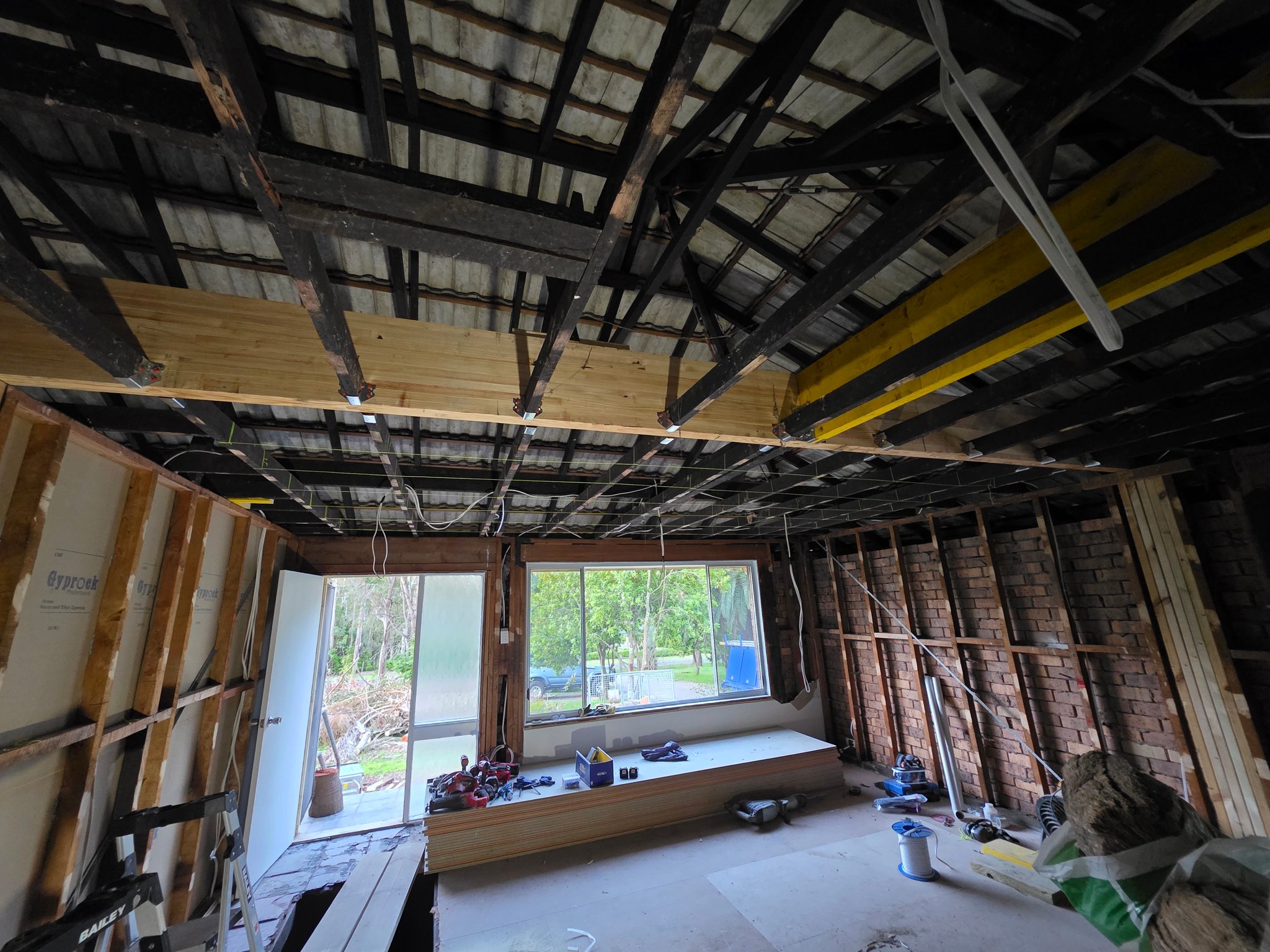 Inside a house taken back to the frame and rafters
