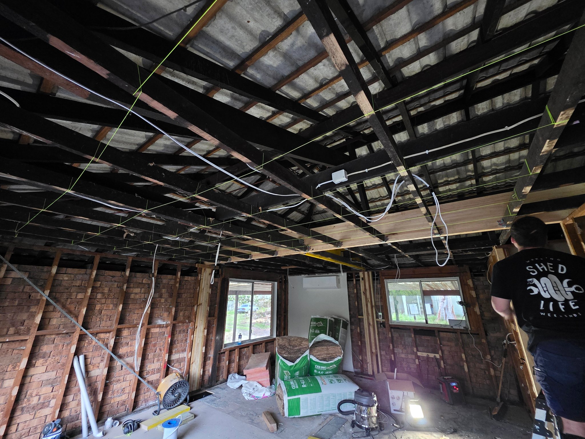 Walls and ceiling stripped back to the frame and rafters during a renovation