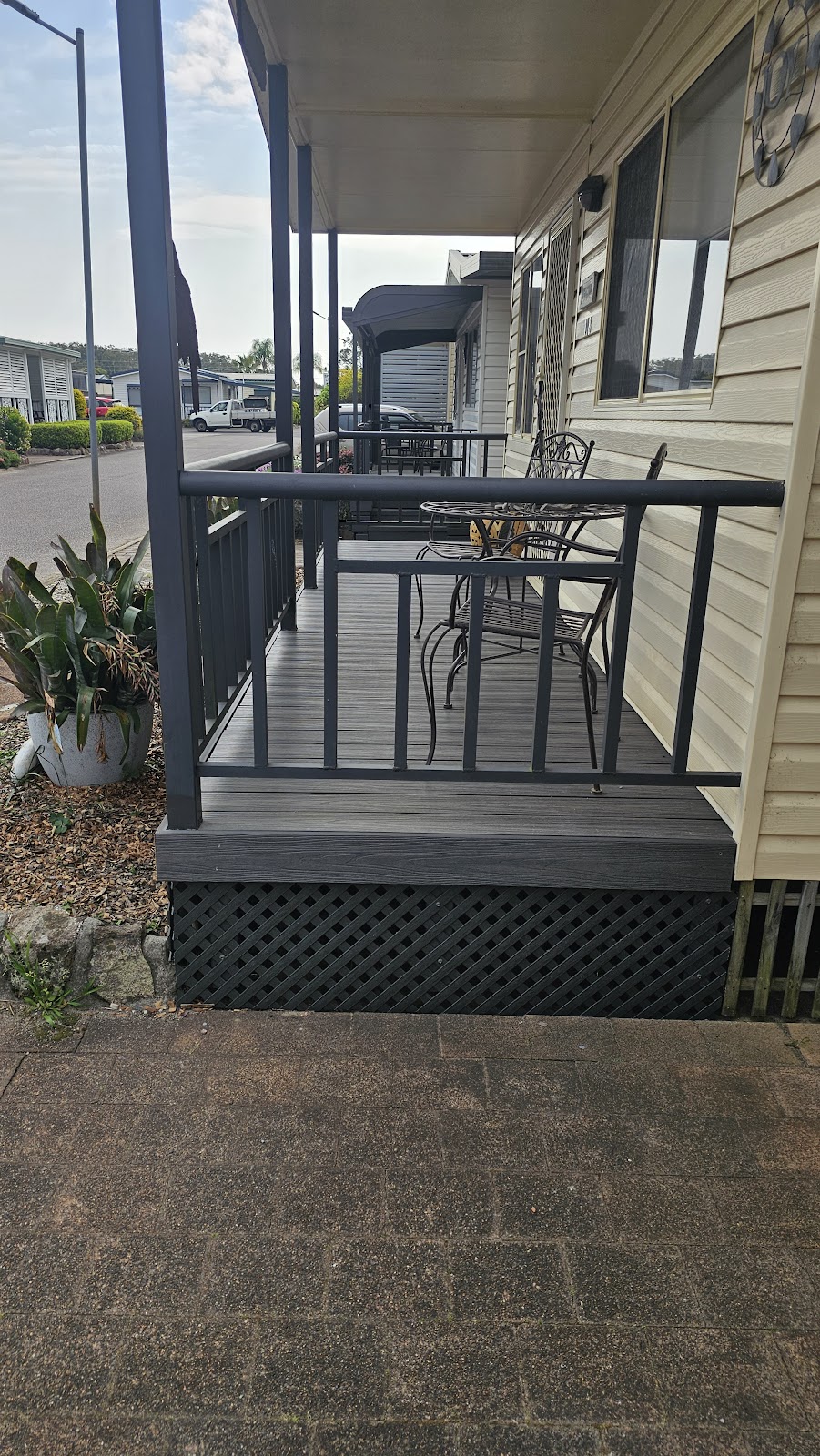New front deck with dark balustrade on a weatherboard home