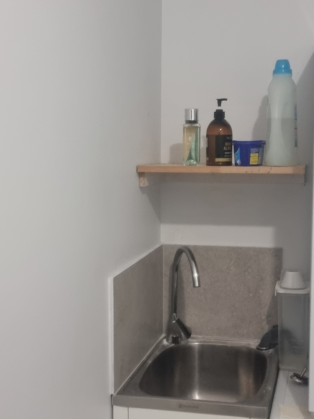 Laundry sink with a new timber shelf
